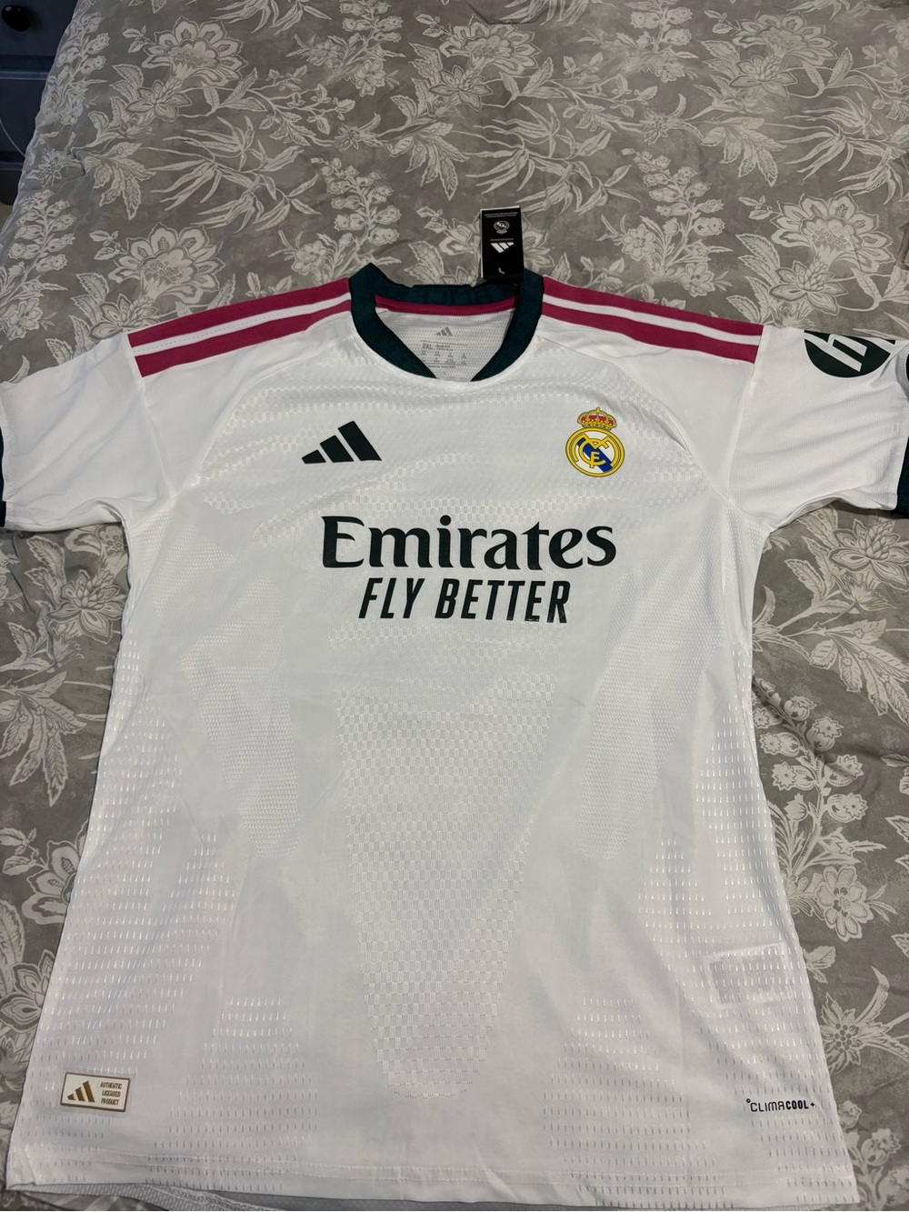 adidas White Real Madrid Home Jersey with Pink Stripes and Dark Green Accents